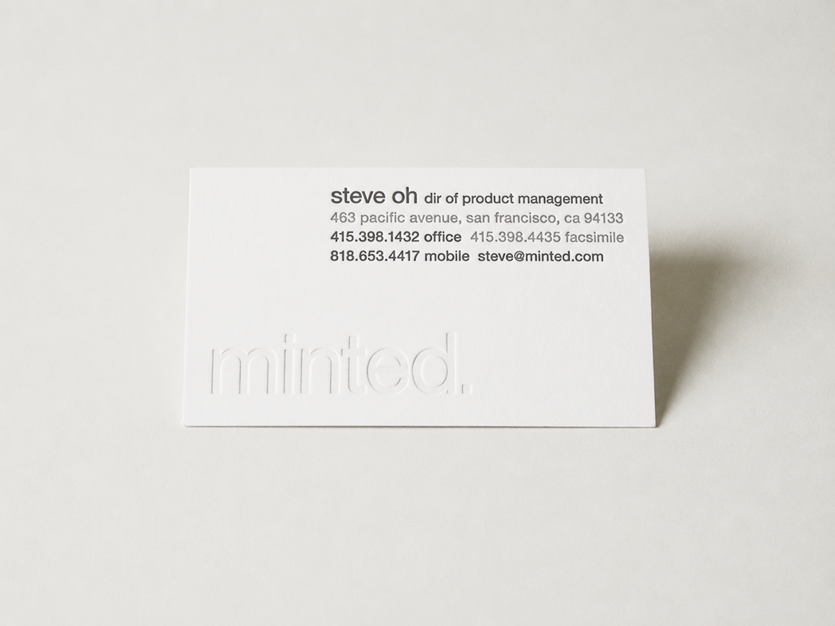 Minted business card featuring a blind-debossed logo