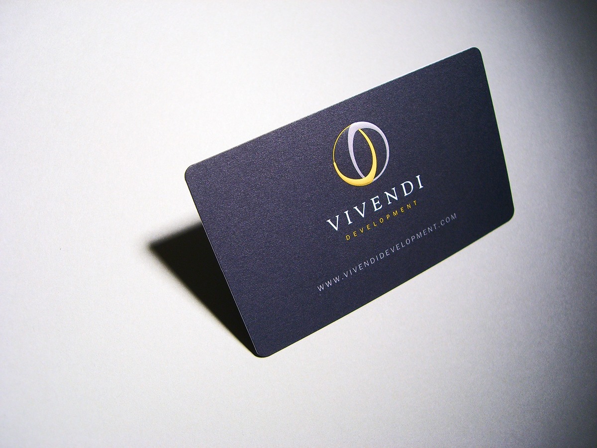 Vivendi Development dark business card with yellow and silver logo